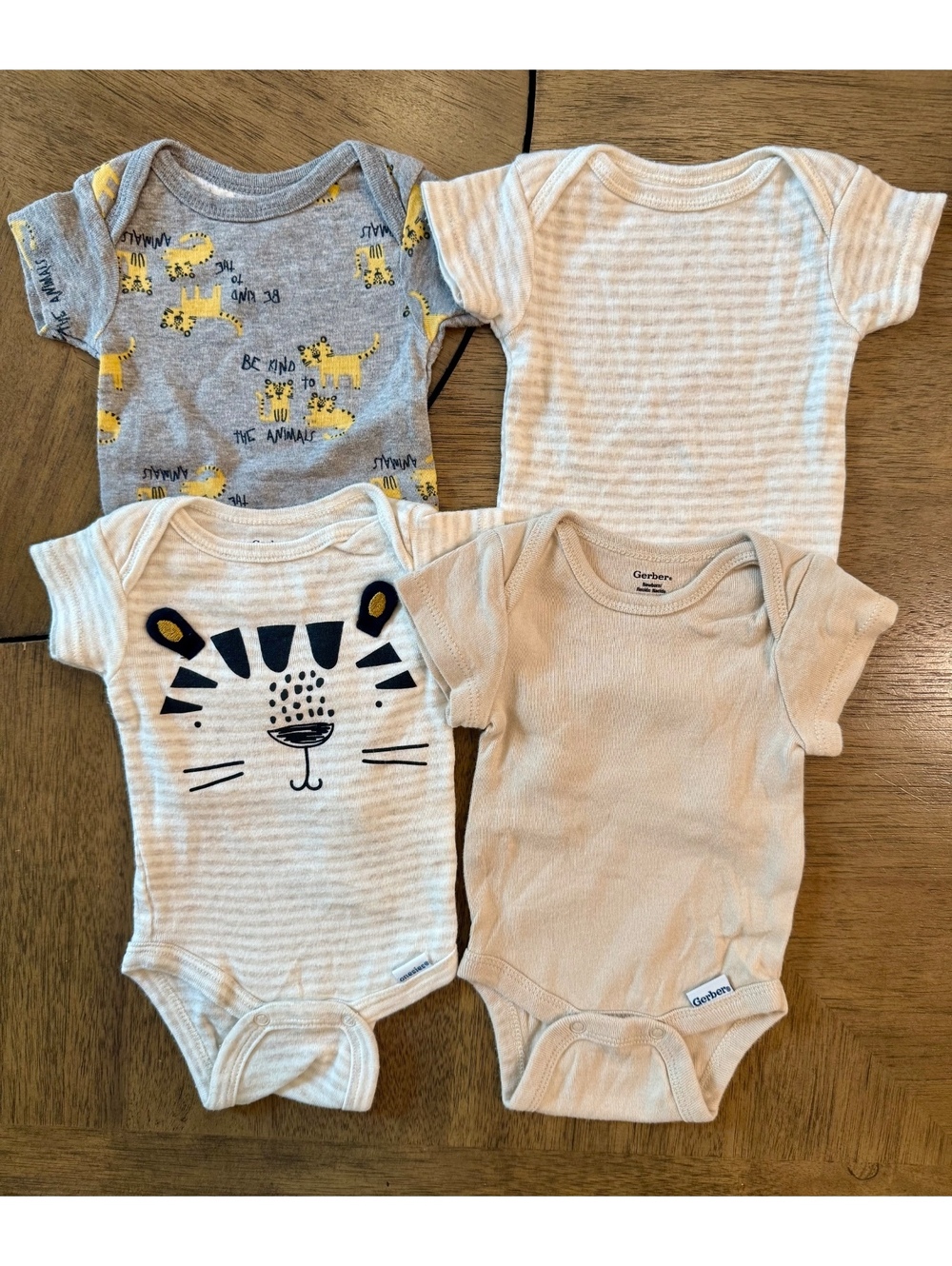 Gerber Newborn Baby Bodysuits 4-Pack - Animal and Striped Designs